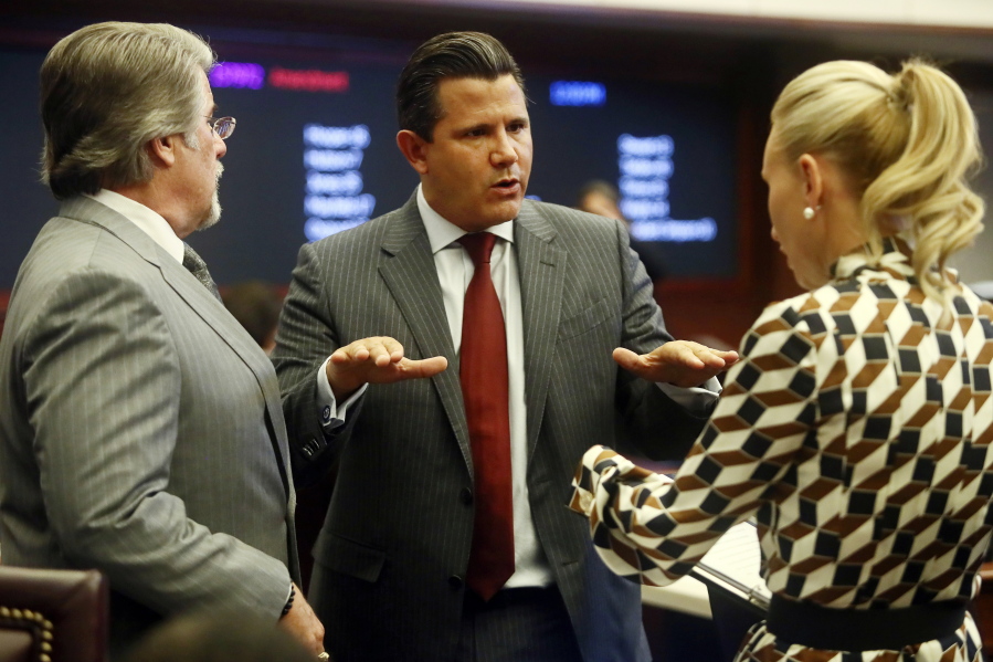 State Sens., from left, Gary Farmer, D-Lighthouse Point, Jason Pizzo, D-North Miami Beach and Lauren Book, D-Plantation confer during debate on Senate Bill CS/SB 2-D: Property Insurance in the Florida Senate Tuesday, May 24, 2022 at the Capitol in Tallahassee, Fla.