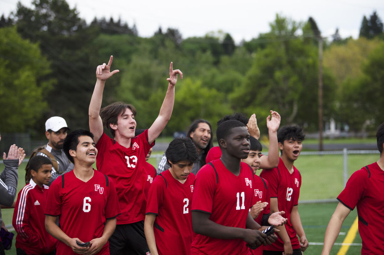 Fort Vancouver boys soccer players celebrate after the Trappers' 2-0 win over Ridgefield in 2A boys soccer district playoff on Saturday, May 14, 2022.
