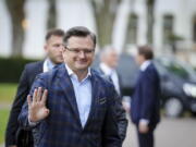 Dmytro Kuleba, foreign minister of Ukraine, waves as he arrives for the G7 Group of leading democratic economic powers at the Weissenhaus resort in Weissenhaeuser Strand, Germany, Friday May 13, 2022. In addition to the United States and Germany, the G7 also includes Great Britain, France, Italy, Canada and Japan. The main topic of the meeting is the war in Ukraine.