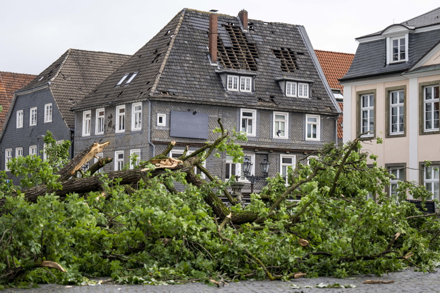 A view of the damaged roof of a residential building in Lippstadt, Germany, a day after heavy rains and storms hit the area, Saturday, May 21, 2022.