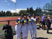 From left, Heritage softball players Makenzie Misner, Cayleigh White, Hailey Dowell and Larissa Villa show the balls each hit for home runs in a 10-5 win over Timberline at the 3A bi-district tournament on Saturday, May 21, 2022 in Lacey.