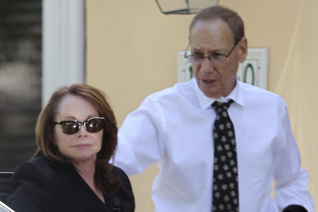 FILE - Shirley Sotloff and her husband, Arthur B. Sotloff, exit a car as they return home after a memorial service for their son, slain journalist Steven Sotloff, at Temple Beth Am, Friday, Sept. 5, 2014, in Pinecrest, Fla. The family of slain American journalist Steven Sotloff filed a federal lawsuit Friday, May 13, 2022, accusing prominent Qatari institutions of wiring $800,000 to an Islamic State "judge" who ordered the murder of Sotloff and another American journalist, James Foley.