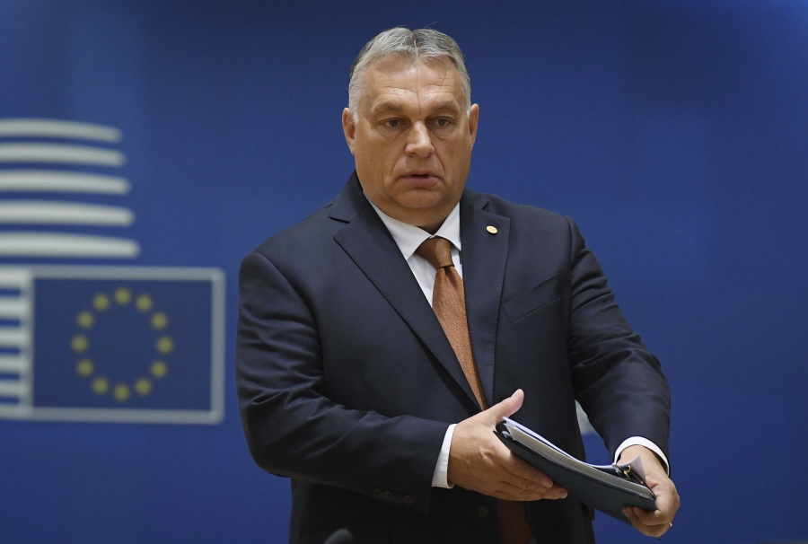 FILE - Hungary's Prime Minister Viktor Orban arrives to a round table meeting at an EU summit in Brussels, Friday, Oct. 22, 2021. The European Commission has launched proceedings that could ultimately lead to the partial suspension of support payments to Hungary for breaching the 27-nation bloc's rule-of-law standards. The EU's executive arm said Wednesday, April 27, 2022 that it has given Hungary formal notification and the country has two months to provide explanations and propose remedies.