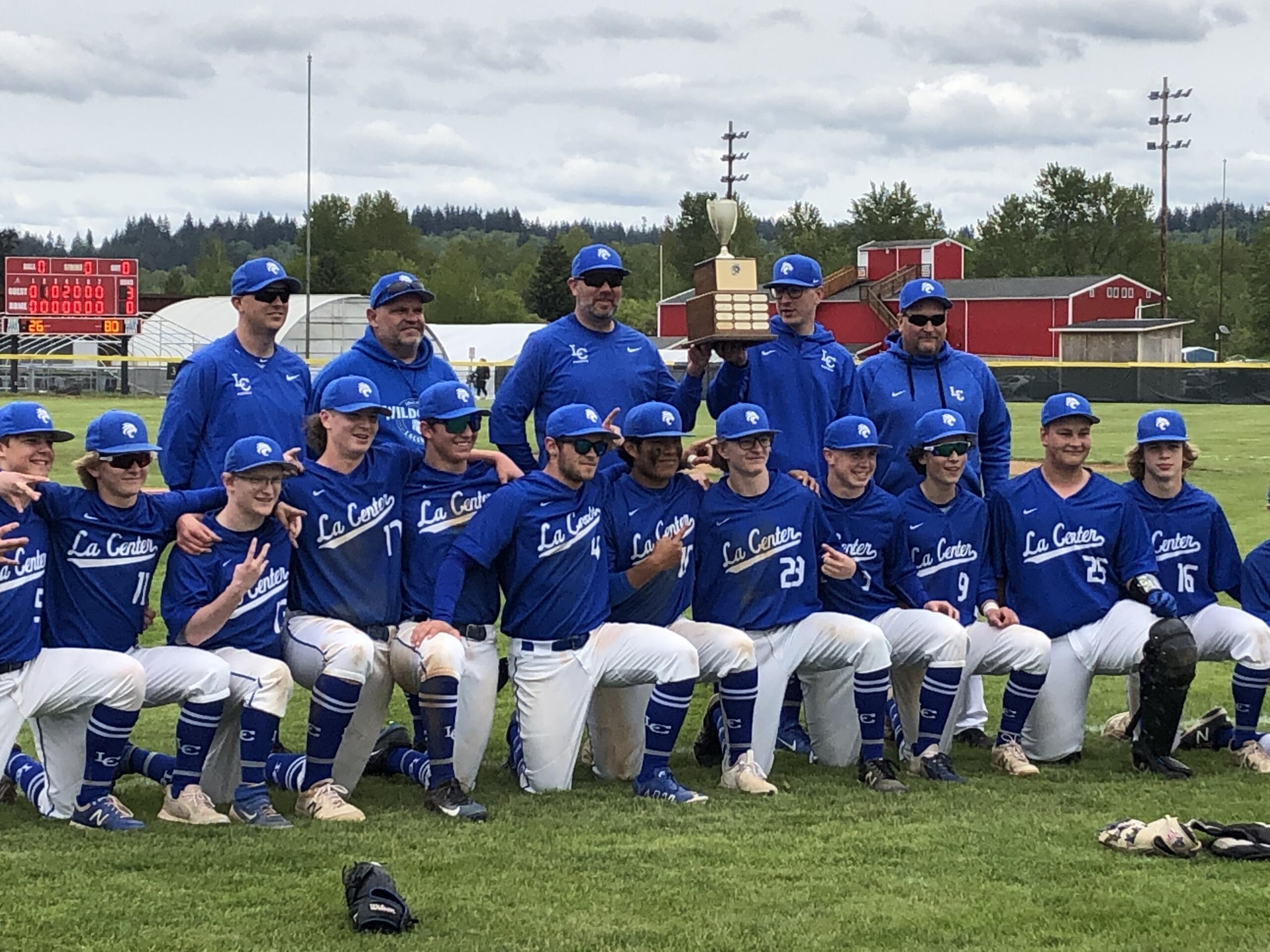 The La Center baseball team poses with the district championship trophy after beating Elma 3-0 in the championship game on Friday at Castle Rock High School.