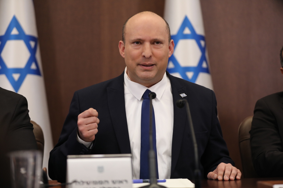 Israeli Prime Minister Naftali Bennett, center, attends a cabinet meeting at the prime minister's office in Jerusalem, Sunday, May 15, 2022.