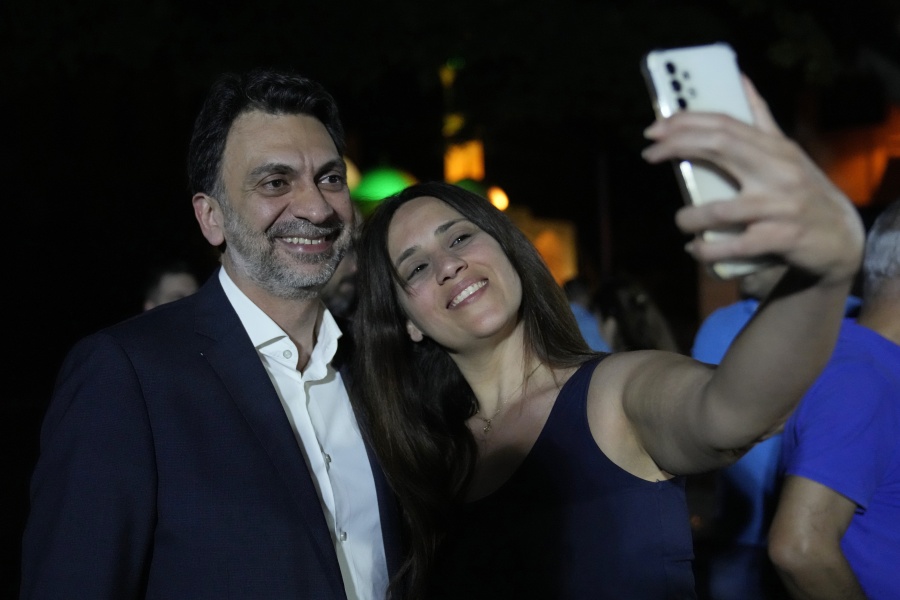 Ibrahim Mneimneh, a 46-year-old architect and one of 13 independent newcomers who won a seat in the latest parliamentary elections, poses for a selfie with one of his supporters during an event celebrating the election outcome, in Beirut, Lebanon, Saturday, May 21, 2022. The strong showing by civil society activists has restored some hope among Lebanese that change is possible. But the reform movement is fragmented and the challenges it faces in fighting an entrenched, sectarian-based ruling clique are enormous.