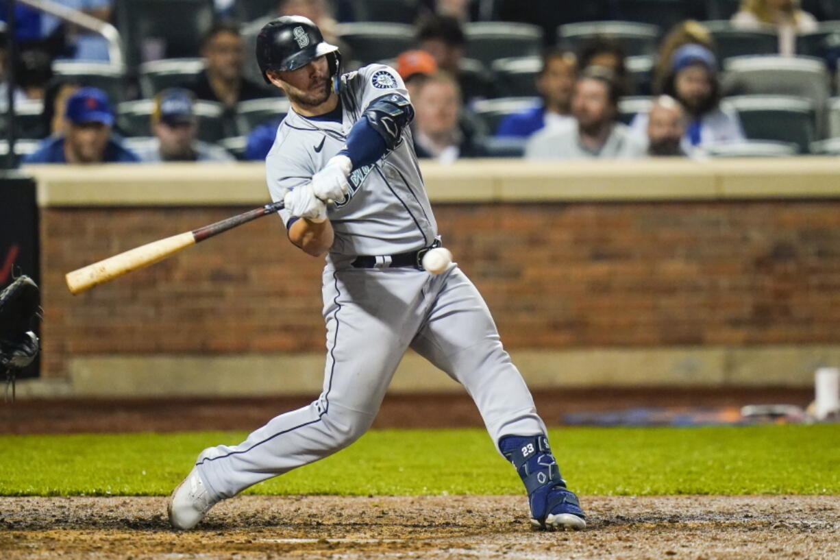 Seattle Mariners' Ty France hits an RBI single during the eighth inning of a baseball game against the New York Mets Friday, May 13, 2022, in New York.