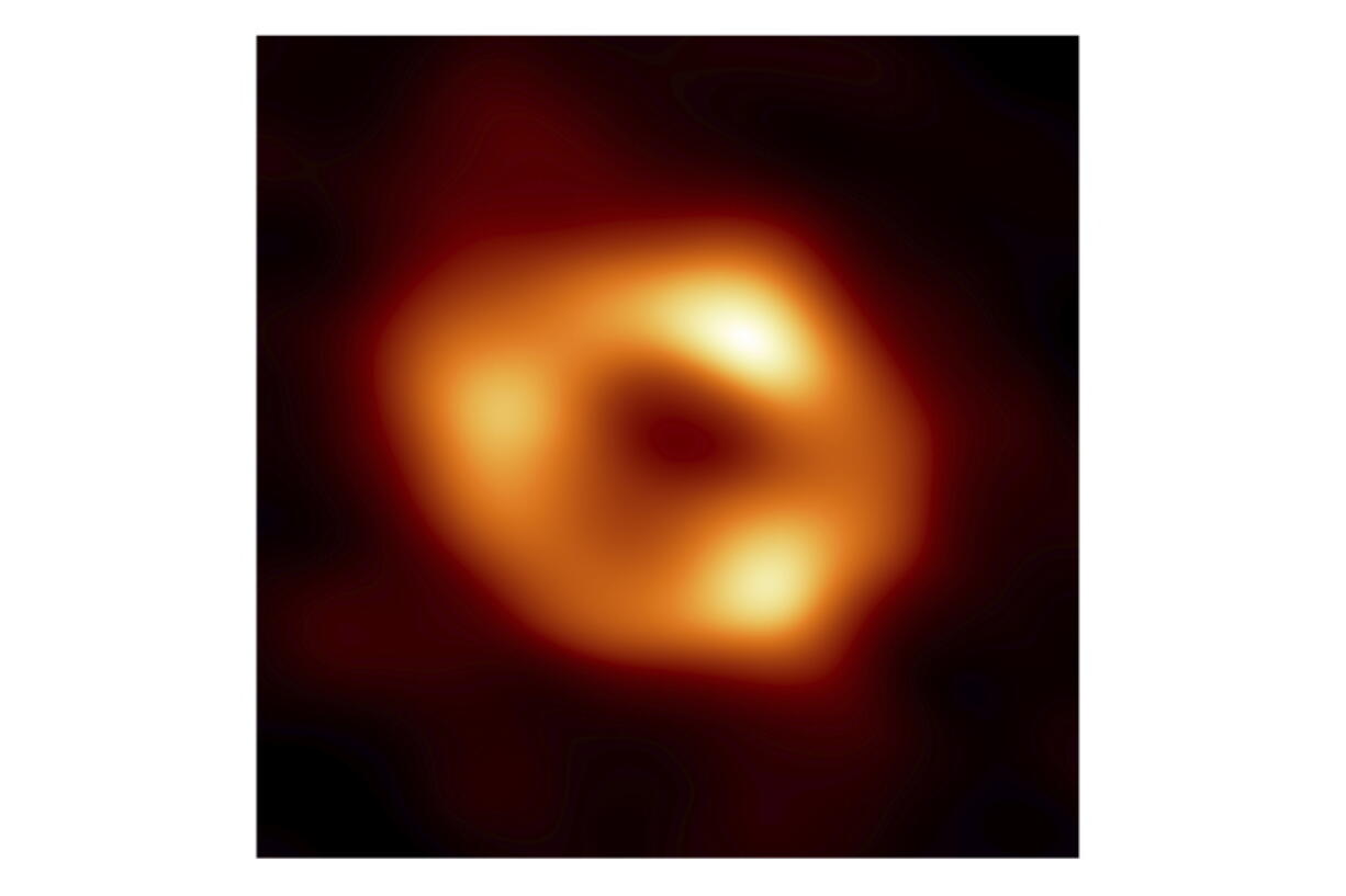 This image released by the Event Horizon Telescope Collaboration, Thursday, May 12, 2022, shows a black hole at the center of our Milky Way galaxy. The Milky Way black hole is called Sagittarius A*, near the border of Sagittarius and Scorpius constellations. It is 4 million times more massive than our sun. The image was made by eight synchronized radio telescopes around the world.