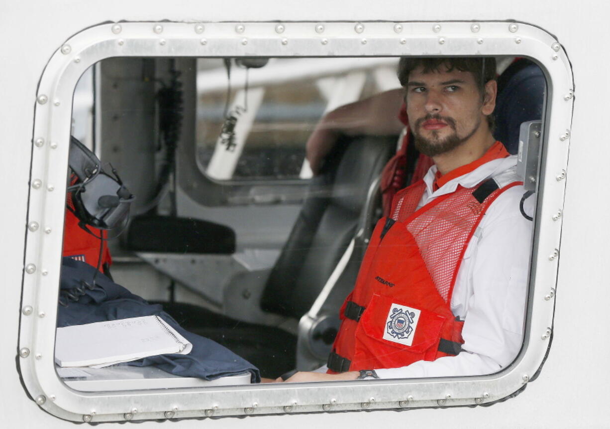 FILE -- Nathan Carman arrives in a small boat at the US Coast Guard station, in Boston, Tuesday, Sept. 27, 2016. Carman spend a week at sea in a life raft before being rescued by a passing freighter. Carman is to be arraigned in federal court, in Rutland, Vt., Wednesday, May 11, 2022, on charges of killing his mother during a fishing trip at sea to inherit the family's wealth.