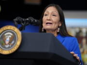 FILE - Interior Secretary Deb Haaland speaks during a Tribal Nations Summit during Native American Heritage Month, in the South Court Auditorium on the White House campus, on Nov. 15, 2021, in Washington.  The Biden administration says it is canceling three oil and gas lease sales scheduled in the Gulf of Mexico and off the coast of Alaska. That will remove millions of acres from possible drilling as U.S. gas prices reach record highs.