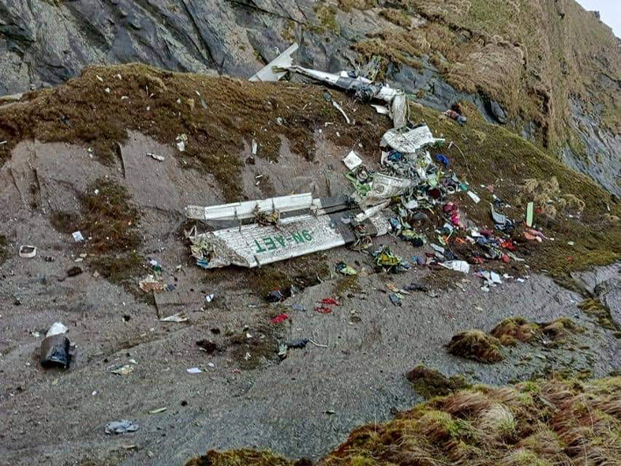 This handout photograph released by Fishtail Air, shows the wreckage of a plane in a gorge in Sanosware in Mustang district close to the mountain town of Jomsom, west of Kathmandu, Nepal, Monday, May 30, 2022. The wreckage of a plane carrying 22 people that disappeared in Nepal's mountains was found Monday scattered on a mountainside, the army said. There was no word on survivors.