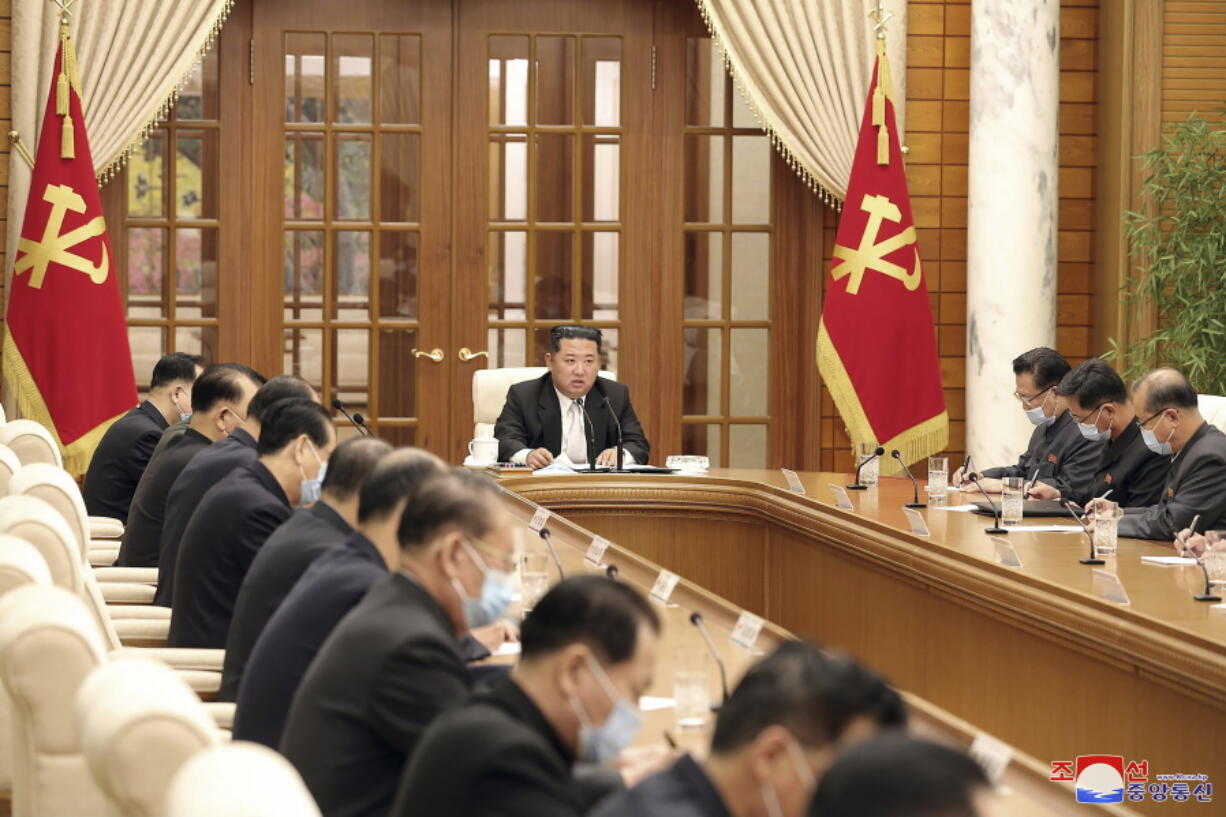 In this photo provided by the North Korean government, North Korean leader Kim Jong Un, center, attends a meeting of the Central Committee of the ruling Workers' Party in Pyongyang, North Korea Thursday, May 12, 2022. Independent journalists were not given access to cover the event depicted in this image distributed by the North Korean government.
