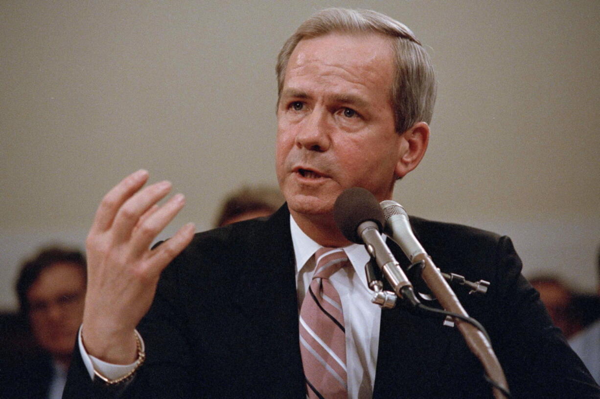 FILE - Former national security adviser Robert C. McFarlane gestures while testifying before the House-Senate panel investigating the Iran-Contra affair on Capitol Hill in Washington, May 13, 1987. McFarlane, a top aide to President Ronald Reagan who pleaded guilty to charges for his role in an illegal arms-for-hostages deal known as the Iran-Contra affair, died Thursday, May 12, 2022. He was 84.