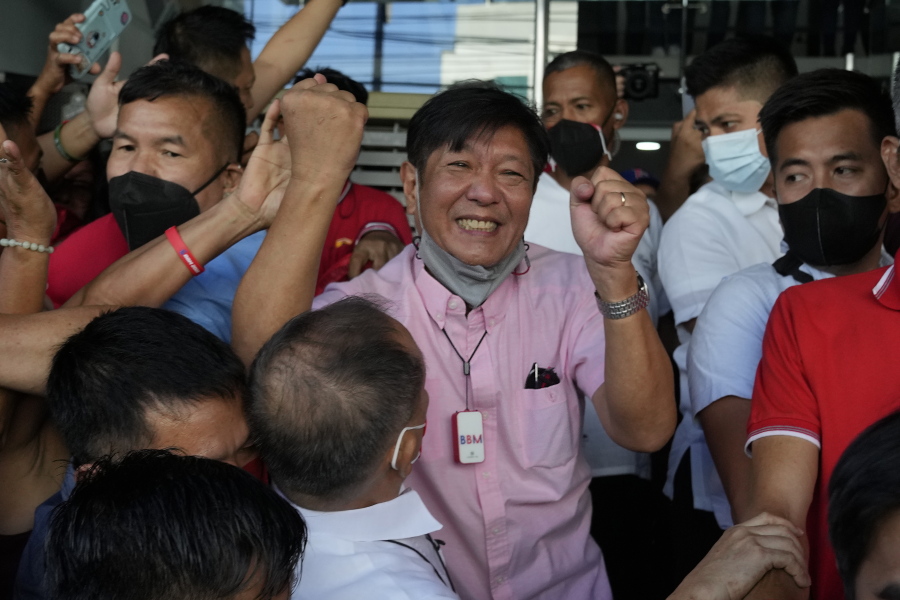 FILE - Presidential candidate Ferdinand "Bongbong" Marcos Jr. celebrates as he greets the crowd outside his headquarters in Mandaluyong, Philippines on Wednesday, May 11, 2022. Allies of the Philippines' presumptive next president, Marcos Jr., appear set to strongly dominate both chambers of Congress, further alarming activists after the late dictator's son scored an apparent election victory that will restore his family to the seat of power.