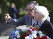 U.S Treasury Secretary Janet Yellen, right, talks to Holocaust survivor, Marian Turski, while attending a wreath-laying ceremony in front of the Ghetto Heroes Monument in Warsaw, Poland, Monday, May 16, 2022.