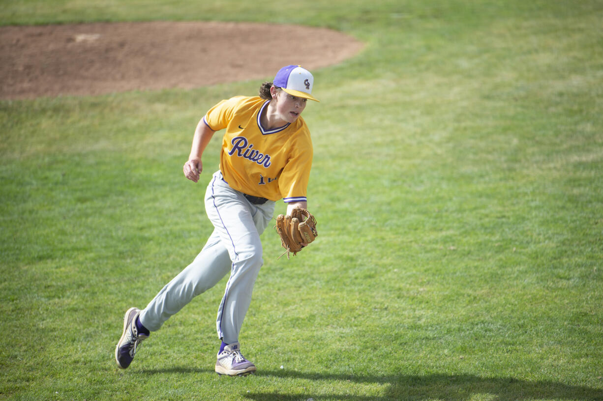 Columbia River's Casey Struckmeier catches a popped bunt attempt that led to a double play during the Rapids' 1-0 loss to Tumwater in the Class 2A state championship baseball team in Yakima on Saturday, May 28, 2022.