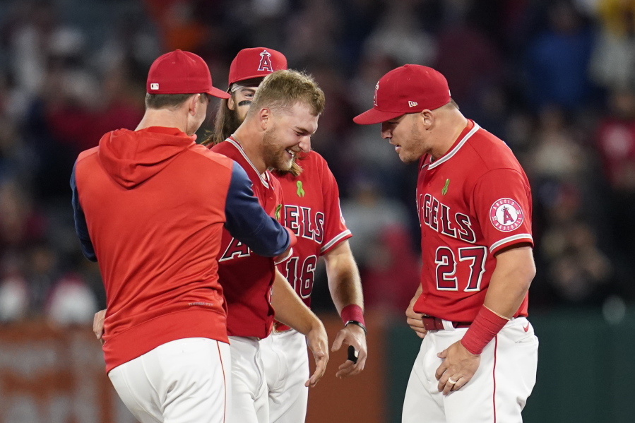 Los Angeles Angels starting pitcher Reid Detmers (48) celebrates with Mike Trout (27) after throwing a no hitter against the Tampa Bay Rays in a baseball game in Anaheim, Calif., Tuesday, May 10, 2022. The Angels won 12-0.