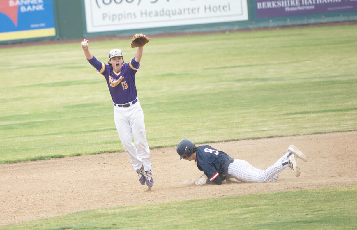 Columbia River's Casey Struckmeier (15) celebrates after making the final out on a force play at second during the Rapids' 1-0 win over Ellensburg in the 2A state baseball semifinal at Yakima County Stadium on Friday, May 27, 2022.
