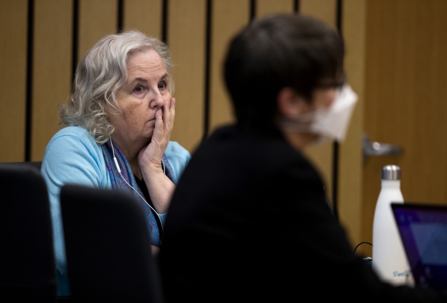 Romance writer Nancy Crampton Brophy, left, watches proceedings in court in Portland on April 4. She was found guilty of second-degree murder on Wednesday.