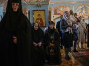 Christian Orthodox worshippers and nuns attend a service at Archangel Saint Michael monastery, in Odesa, Ukraine, Sunday, May 15, 2022. Almost three months after Russia shocked the world by invading Ukraine, its military faces a bogged-down war.