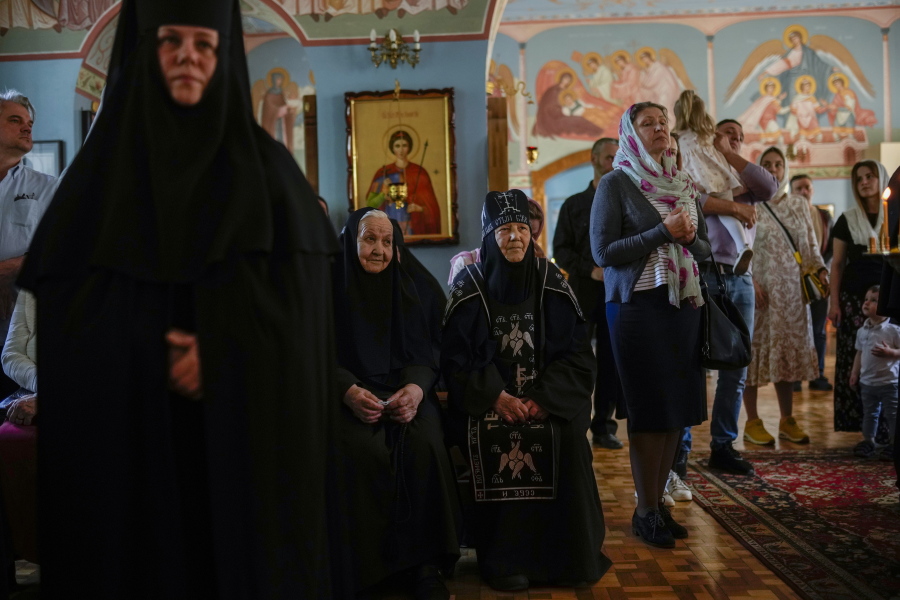 Christian Orthodox worshippers and nuns attend a service at Archangel Saint Michael monastery, in Odesa, Ukraine, Sunday, May 15, 2022. Almost three months after Russia shocked the world by invading Ukraine, its military faces a bogged-down war.