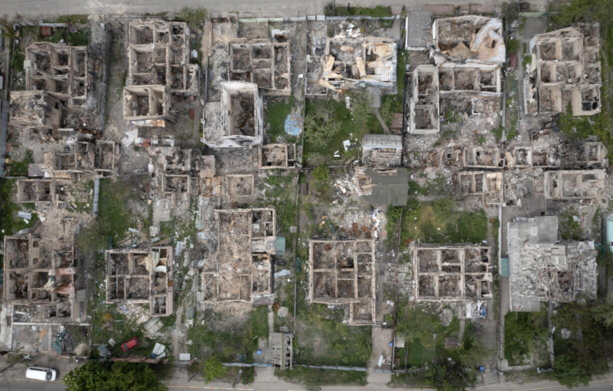 An aerial view of a residential area ruined by the Russian shelling in Irpin close to Kyiv, Ukraine, Saturday, May 21, 2022.