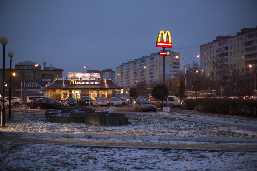 FILE - McDonald's restaurant is seen in the center of Dmitrov, a Russian town 75 km., (47 miles) north from Moscow, Russia, on Dec. 6, 2014. McDonald's says it's started the process of selling its Russian business, which includes 850 restaurants that employ 62,000 people. The fast food giant pointed to the humanitarian crisis caused by the war, saying holding on to its business in Russia "is no longer tenable, nor is it consistent with McDonald's values." The Chicago-based company had temporarily closed its stores in Russia but was still paying employees.