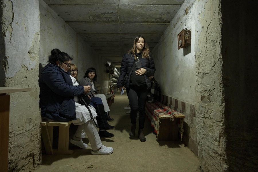 Kateryna Galmalova, 32-week pregnant woman displaced from Mykoliav, walks in the bomb shelter as the air sirens go off, at the Lviv state regional perinatal center, western Ukraine, Thursday, April 7, 2022. "I do not want children to be born in war," she said. "And I do not want to give birth in war. And I don't want to give birth in a basement or a bunker.