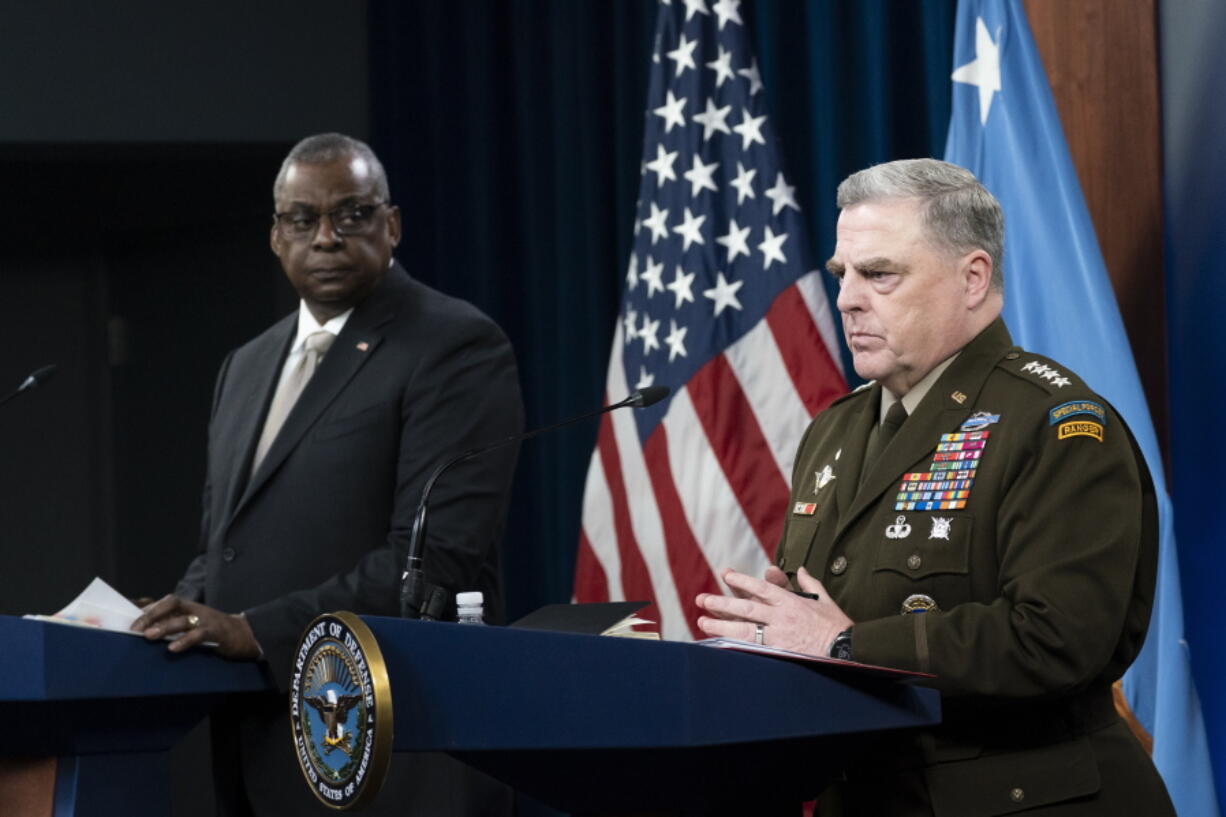 Secretary of Defense Lloyd Austin, left, and Joint Chiefs Chairman Gen. Mark Milley, speak with reporters after a virtual meeting of the Ukraine Defense Contact Group at the Pentagon, Monday, May 23, 2022, in Washington.