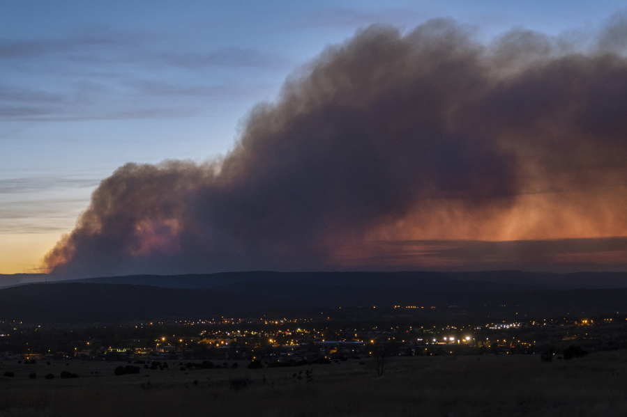 Smoke from the Calf Canyon/Hermits Peak Fire drifts over Las Vegas, N.M., on Saturday, May 7, 2022.