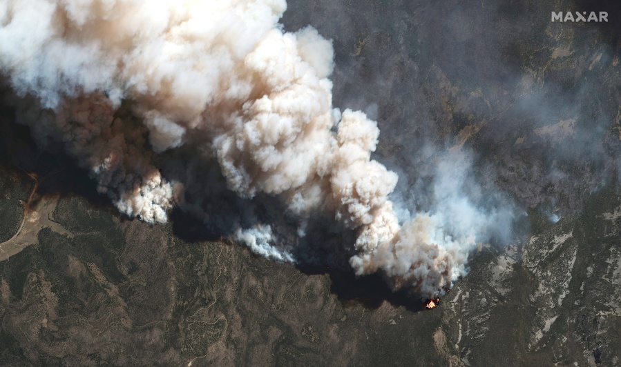 This satellite image provided by Maxar Technologies shows the active fire lines of the Hermits Peak wildfire, in Las Vegas, New Mexico, on Wednesday, May 11, 2022. Wildfire in the West is on a furious pace early this year. Wind-driven flames tearing through vegetation that is extraordinarily dry from years-long drought exacerbated by climate change has made even small blazes a threat to life and property.