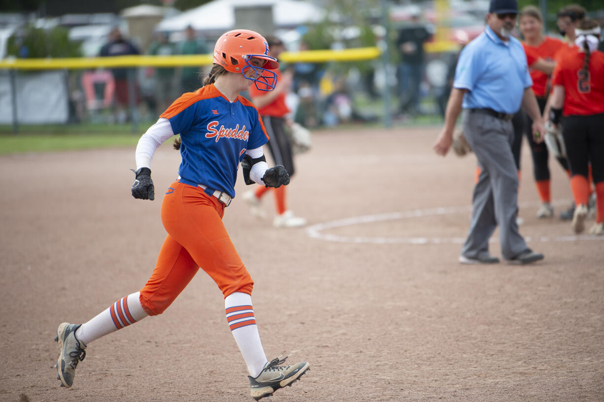 Ridgefield's Mallory Vancleave rounds third after hitting a two-run home run during the Spudders' 10-0 win over West Valley-Spokane in the 2A state softball tournament in Selah on Friday, May 27, 2022.