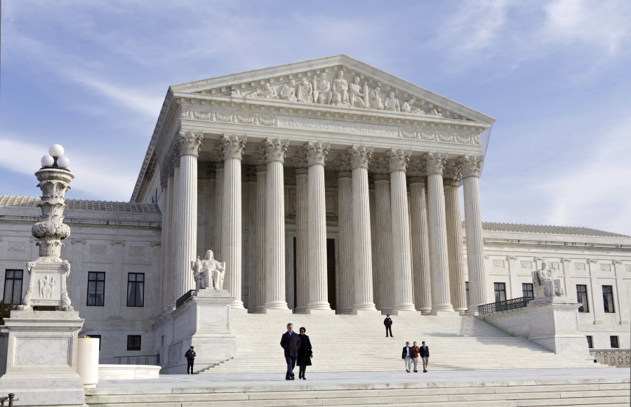 FILE - This photo shows the U.S. Supreme Court Building, Wednesday, Jan. 25, 2012 in Washington. A draft opinion circulated among Supreme Court justices suggests that a majority of high court has thrown support behind overturning the 1973 case Roe v. Wade that legalized abortion nationwide, according to a report published Monday night, May 2, 2022 in Politico. (AP Photo/J.