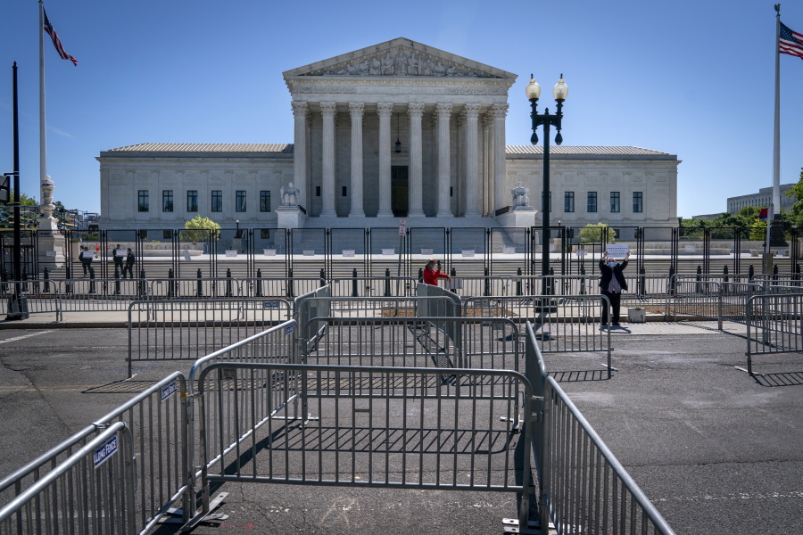 Pens for protesters are set up before anti-scaling fencing that blocks off the stairs to the Supreme Court, Tuesday, May 10, 2022, in Washington.