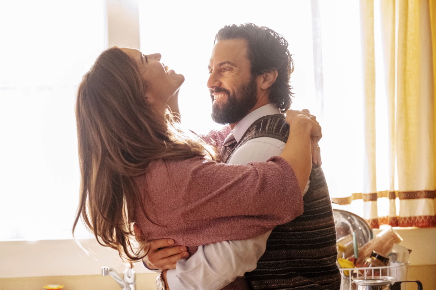 This image released by NBC shows Mandy Moore as Rebecca, left, and Milo Ventimiglia as Jack, in a scene from the final season of "This Is Us." NBC's time-skipping family drama airs its final episode at 9 p.m. EDT Tuesday.