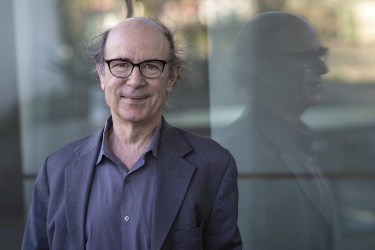 In this photo provided by the Templeton Prize, physicist Frank Wilczek stands for a portrait at Arizona State University in Tempe, Ariz., on March 17, 2022. Wilczek, the Nobel Prize-winning theoretical physicist and author renowned for his boundary-pushing investigations into the fundamental laws of nature, was honored Wednesday, May 11, 2022, with the Templeton Prize, awarded to individuals whose life's work embodies a fusion of science and spirituality.