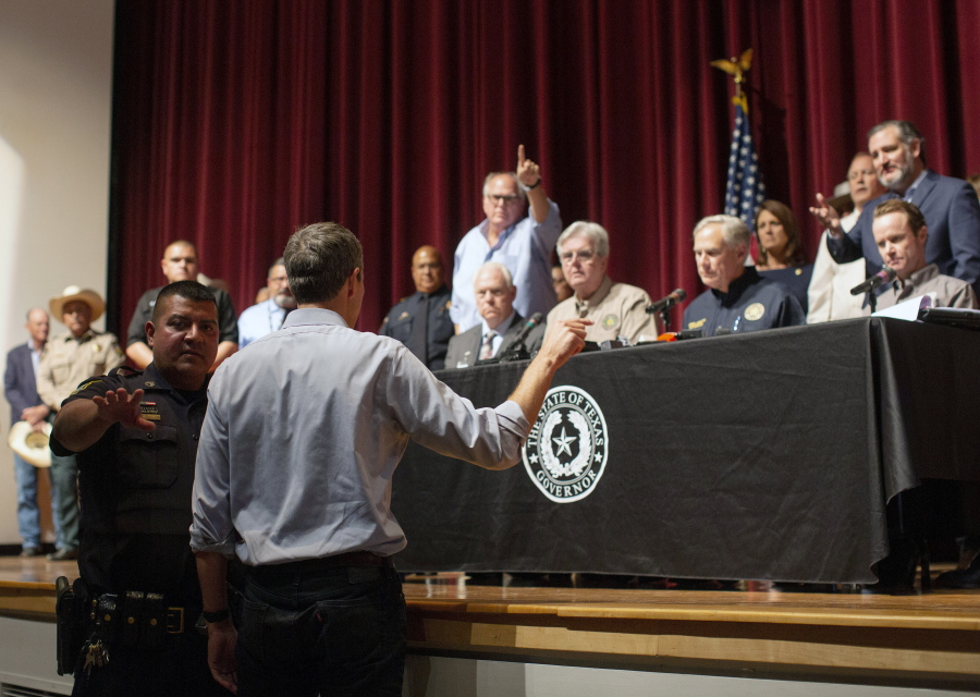 Democrat Beto O'Rourke, who is running against Greg Abbott for governor in 2022, interrupts a news conference headed by Texas Gov. Greg Abbott in Uvalde, Texas Wednesday, May 25, 2022.