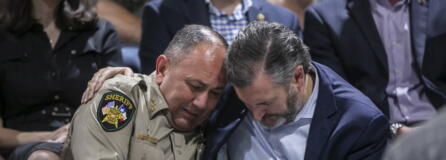 Uvalde County Sheriff Ruben Nolasco, left, is comforted by U.S. Sen. Ted Cruz during a vigil held in honor of the lives lost at Robb Elementary school at the Uvalde County Fairplex Arena in Uvalde, Texas, Wednesday, May 25, 2022.