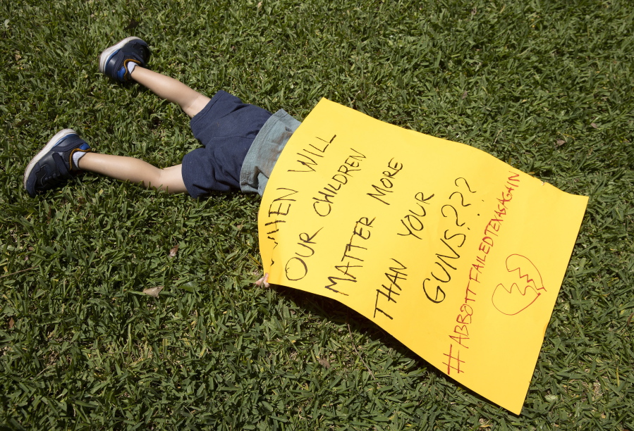Remy Ragsdale, 3, attends a protest organized by Moms Demand Action on Wednesday May 25, 2022, at the Governor's Mansion in Austin, Texas, after a mass shooting at an elementary school in Uvalde.