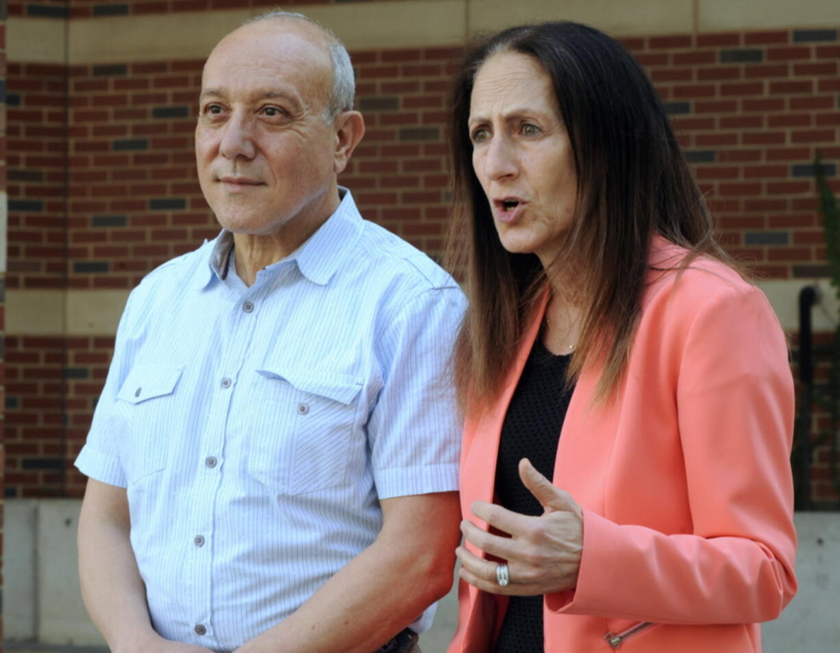 Dr. Hussein D. Abdul-Latif, left, and Dr. Morissa Ladinsky, two University of Alabama at Birmingham professors who treat patients with gender issues, speak during an interview in Birmingham, Ala., on Wednesday, April 13, 2022.