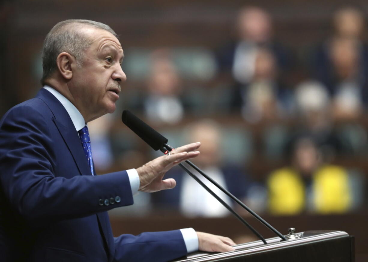 Turkish President Recep Tayyip Erdogan addresses his ruling party legislators, in Ankara, Turkey, Wednesday, May 18, 2022.