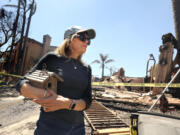 Sandy Vogel raised her family in this home in the Coronado Pointe neighborhood, but it was completely destroyed, save for a bird house from the front yard tree, after at least 20 homes in Laguna Niguel, California, were destroyed by fire, on Thursday, May 12, 2022.