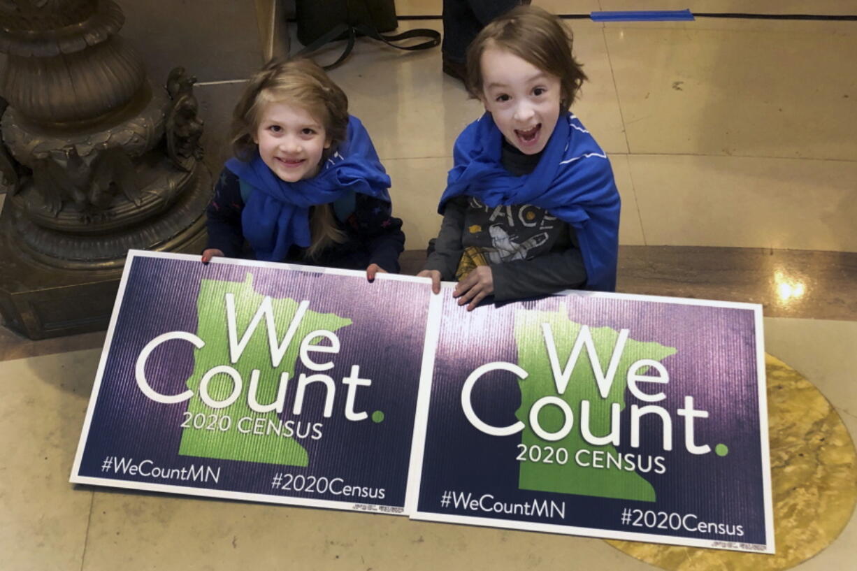 FILE - In this April 1, 2019, photo, Noelle Fries, 6, left, and Galen Biel, 6, both of Minneapolis, attend a rally at the Minnesota Capitol to kick off a year-long drive to try to ensure that all Minnesota residents are counted in the 2020 census. Around 1 in 20 residents in Arkansas and Tennessee were missed during the 2020 census. Other U.S. states, including Minnesota, had significant overcounts of their populations, according to figures the U.S. Census Bureau released Thursday, May 19, 2022.