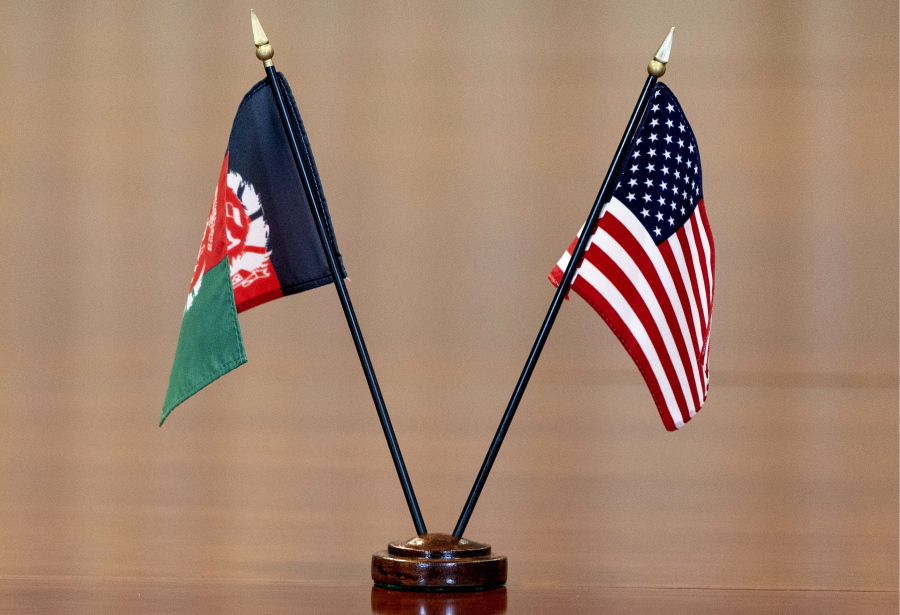 FILE - The flags of Afghanistan and the United States are seen on the table before a meeting at the Pentagon in Washington, June 25, 2021. The United States has taken control of Afghanistan's embassy in Washington and the country's consulates in New York and California. The State Department says it had assumed "sole responsibility" for the security and maintenance of the diplomatic missions effective on Monday and will bar anyone from entering them without its permission.