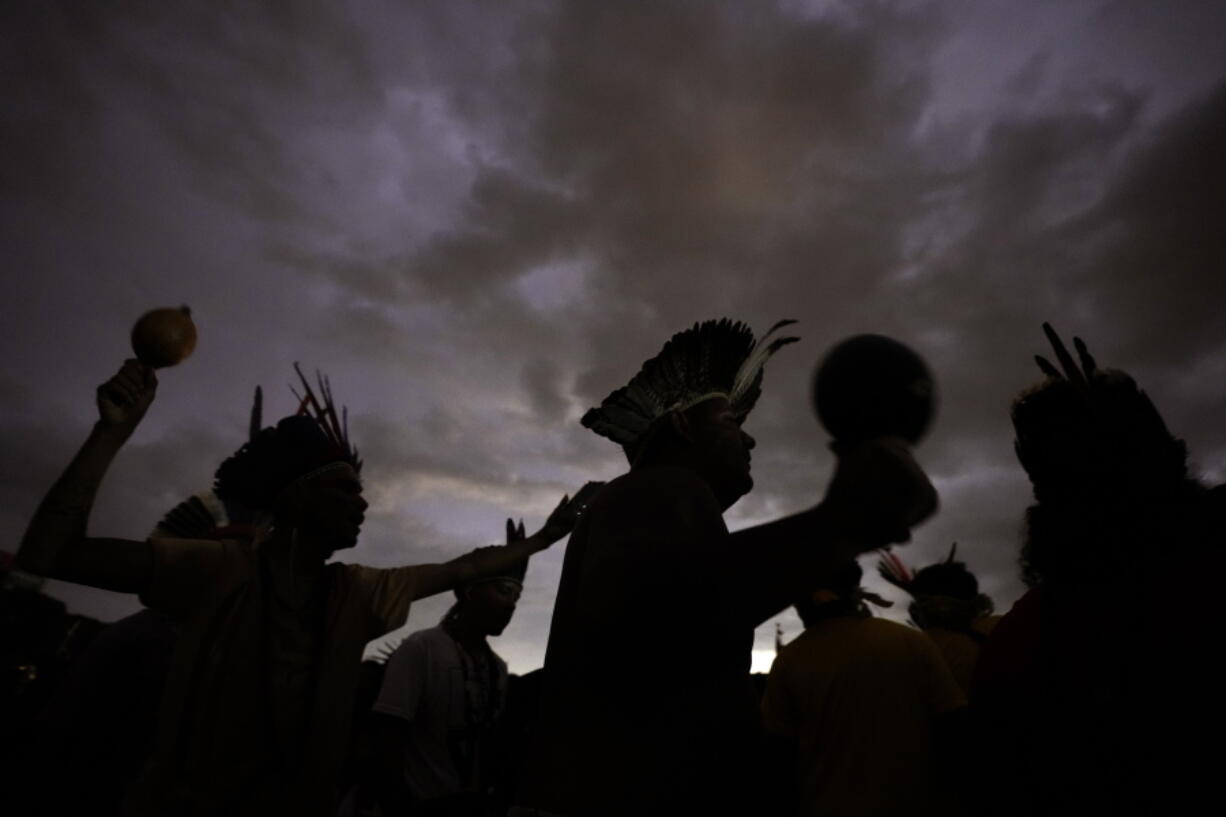 FILE - Indigenous people take part in a march during the 18th annual Free Land Indigenous Camp, in Brasilia, Brazil, Wednesday, April 13, 2022.