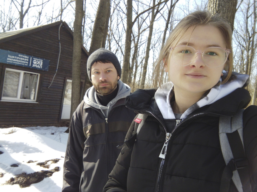 This March 2022 photo provided by Alona Shulenko shows her, right, and fellow zoologist Anton Vlaschenko outside the Feldman Ecopark area outpost of the Ukrainian Bat Rehabilitation Center in Kharkiv, Ukraine. "Our staying in Ukraine, our continuing to work - it's some kind of resistance of Russian invasion," Vlaschenko said via Zoom, a barrage of shelling audible in the background. "The people together in Ukraine are ready to fight, not only with guns.