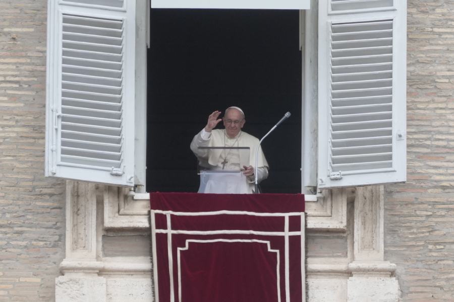 Pope Francis delivers the Regina Coeli noon prayer from his studio window overlooking St. Peter's Square at the Vatican, Sunday, 29, 2002.