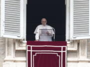 Pope Francis delivers his message from his studio window overlooking St. Peter's Square during the Regina Coeli prayer at the Vatican, Sunday, May 1, 2022.