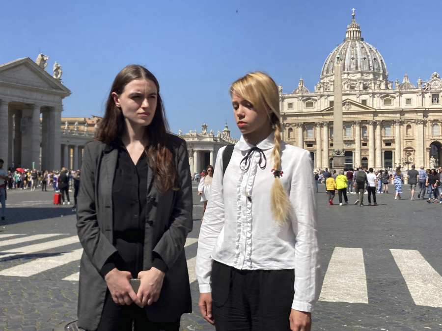Kateryna Prokopenko, right, wife of Azov Regiment Commander Denys Prokopenko, and Yuliia Fedosiuk, both from Ukraine, talk with The Associated Press at the end of the weekly general audience where they met with Pope Francis in St. Peter's Square at The Vatican, Wednesday, May 11, 2022.