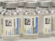 FILE - Vials of the Johnson & Johnson COVID-19 vaccine are seen at a pharmacy in Denver on Saturday, March 6, 2021. On Thursday, May 5, 2022, U.S. regulators strictly limited who can receive this vaccine due to a rare but serious risk of blood clots.